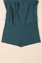 SeaGlass Serve Skort in sea green with crossover V-waist and side pockets for swim activities.