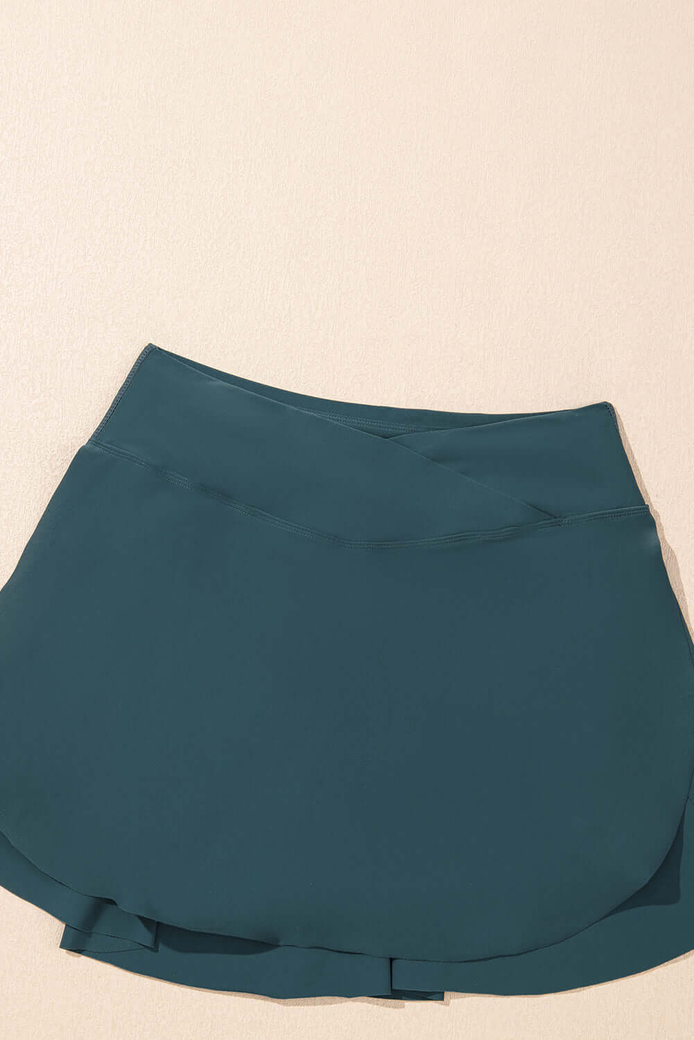 SeaGlass Serve Skort in sea green, high-waisted swim skort with crossover V-waist design and side pockets.