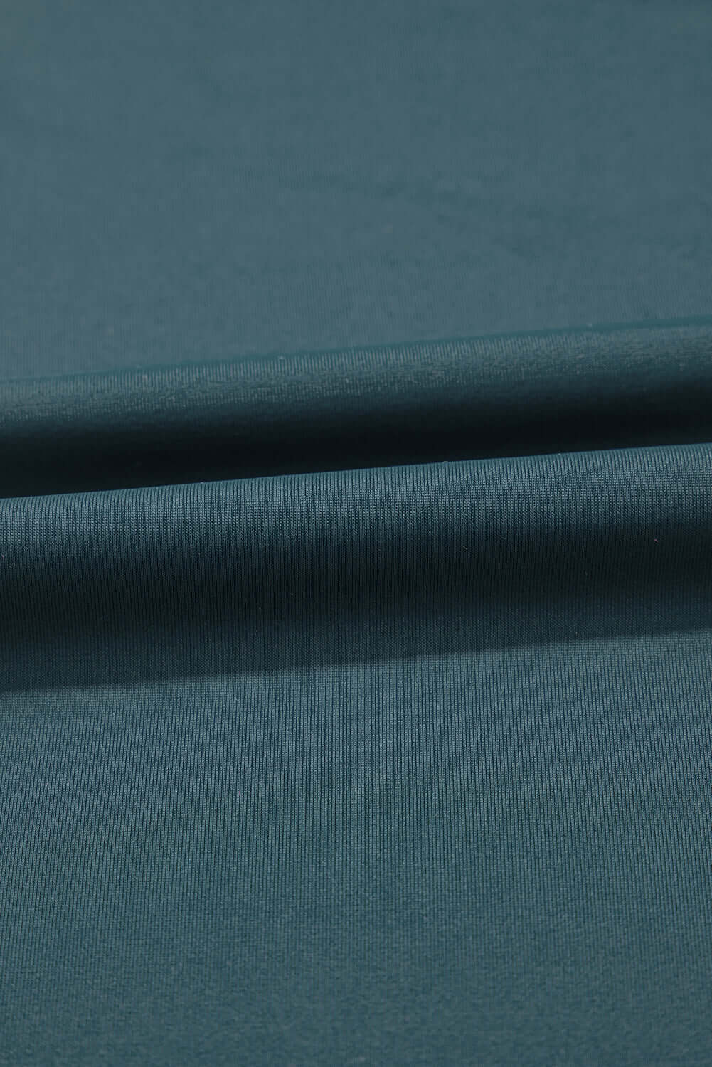Close-up of sea green fabric showcasing soft texture for SeaGlass Serve Skort.