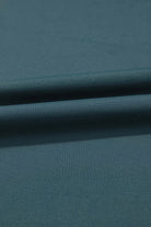 Close-up of sea green fabric showcasing soft texture for SeaGlass Serve Skort.