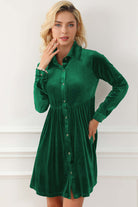 Woman in evergreen VIBRANT VELVET dress by Vivian-Lu, featuring crinkled fabric, collared neck, front buttons, and chest pockets.