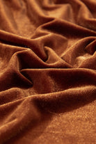 Close-up of luxurious chestnut brown velvet fabric showcasing rich texture and color, used in Vivian-Lu's CHESTNUT CHEER Dress.