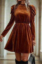 "CHESTNUT CHEER Dress in chestnut brown velvet with gigot sleeves and gathered waist by Vivian-Lu, exuding elegance and comfort."