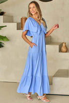 Dreamfield Days maxi dress in sky blue with flutter sleeves and pockets, perfect for summer outings and garden walks.