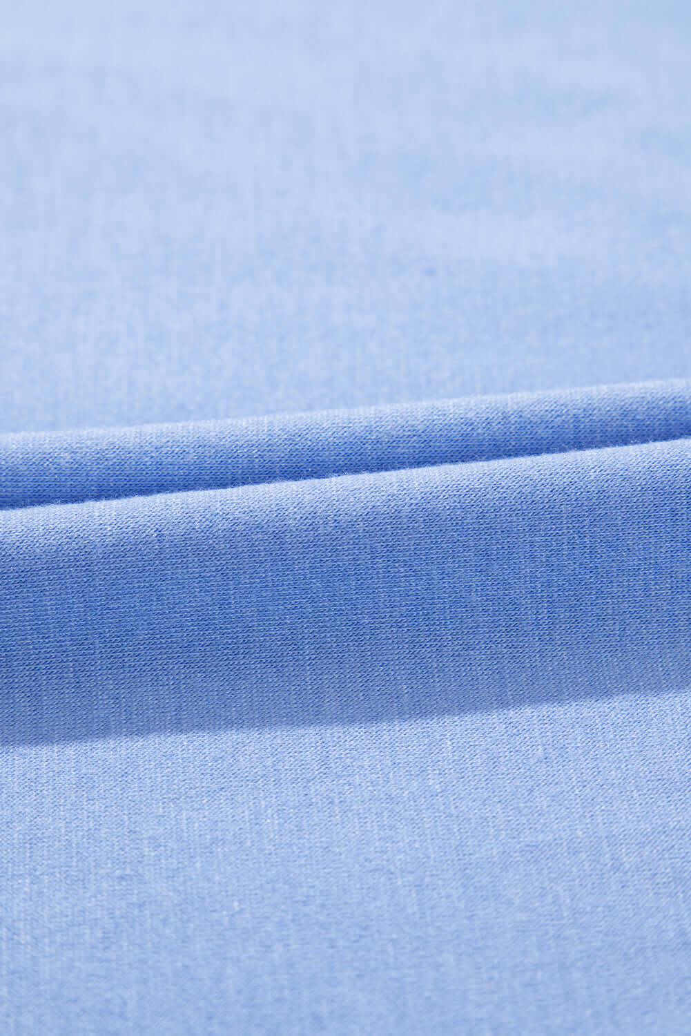Close-up of soft sky blue fabric, showcasing the luxurious texture for the Dreamfield Days Maxi Dress.