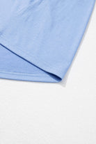 Close-up of the soft sky blue fabric of the DREAMFIELD DAYS Maxi Dress, showcasing its elegant drape and quality material.