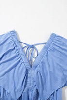 Back view of a sky blue maxi dress with a V-neckline and flutter sleeves, showcasing its comfortable, stretchy fabric.