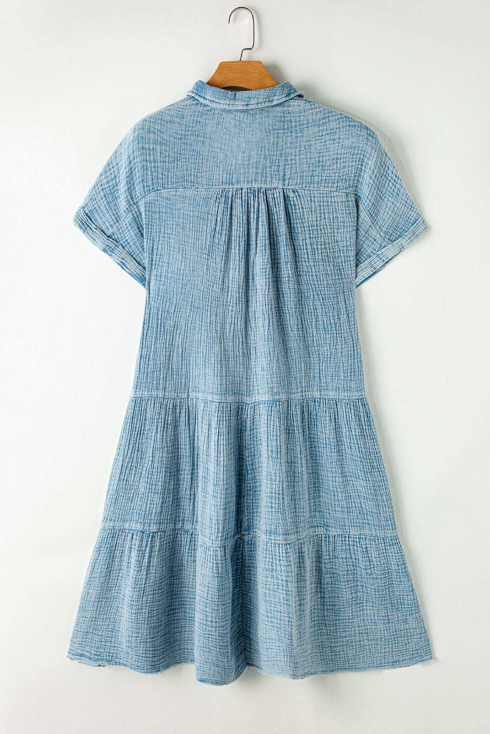 Sky blue mineral-wash dress with tiered silhouette and split neckline, perfect for warm weather.