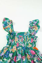 Green floral dress with ruffled sleeves and smocked bodice, perfect for summer outings.
