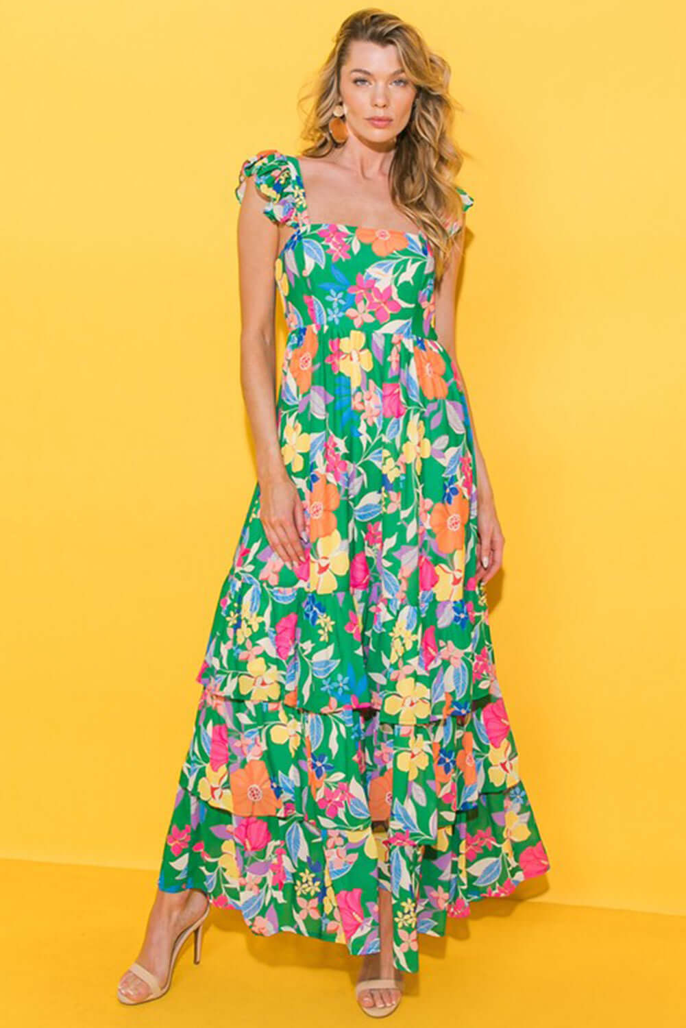 Vibrant summer floral maxi dress with ruffled straps and tiered design, perfect for sunny days.