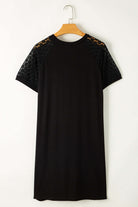 Back view of the Shadow Luxe Dress featuring black lace sleeves and a relaxed t-shirt silhouette.