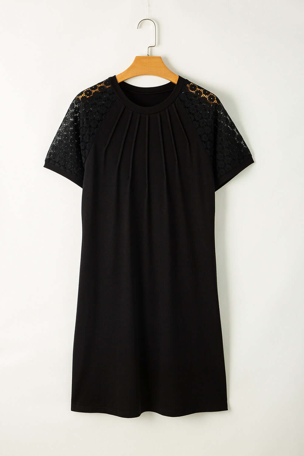 Chic black shift dress with pleated neckline and lace sleeves, perfect for versatile styling from work to date.