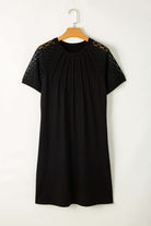 Chic black shift dress with pleated neckline and lace sleeves, perfect for versatile styling from work to date.