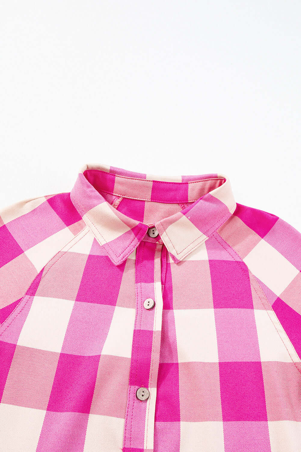 Stylish Check Her Out Dress close-up featuring pink checkered pattern and collared neck.