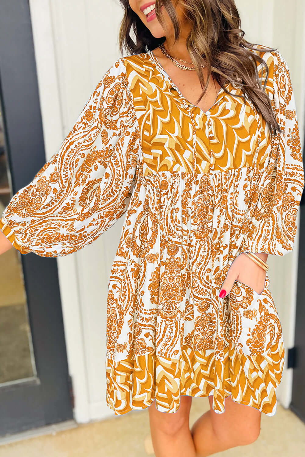 Golden Maize dress by Vivian-Lu with bohemian print, puff sleeves, and tied V-neckline, showcasing a stylish fit-and-flare design.