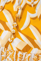 Close-up of chic print on Golden Maize dress by Vivian-Lu, featuring buttons and vibrant yellow-white bohemian pattern.