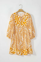 Golden Maize dress with bohemian print, puff sleeves, and tied V-neckline, enhancing feminine charm. 100% polyester fashion by Vivian-Lu.