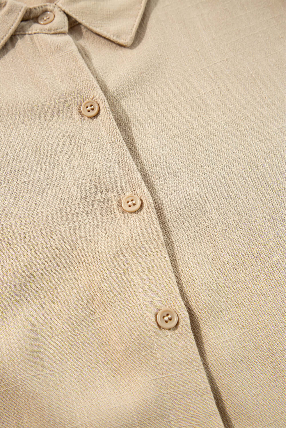 Close-up of VENTURE OUT Dress in Desert Tan featuring buttoned front and shirt-style collar.