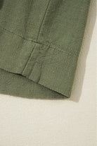 Close-up of Jungle Green VENTURE OUT Dress fabric showcasing its texture and hem detail.