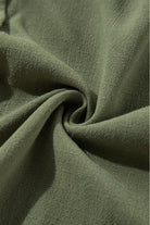 Close-up of Jungle Green fabric from the VENTURE OUT Dress, showcasing its texture and vibrant color.