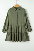 Jungle Green mini dress with puff sleeves, buttoned front, and tiered pleats for a chic, adventurous style.