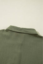 Jungle green fabric detail of VENTURE OUT Dress highlighting shirt collar design.