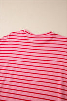 Back view of the Strawberry Sundays Dress, featuring pink and red stripes on a soft cotton fabric.