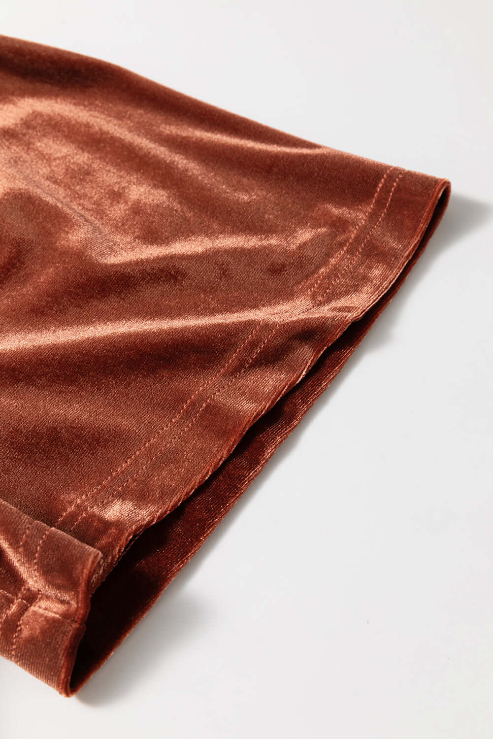 Copper velvet fabric detail of the PENNY FOR YOUR THOUGHTS Maxi Dress from Vivian-Lu, showcasing its luxurious texture.