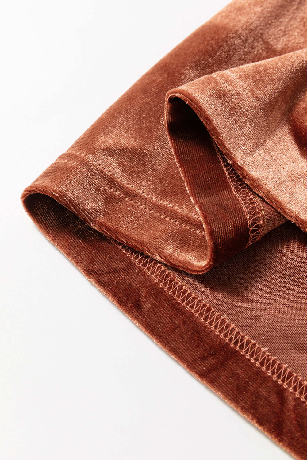 Close-up of luxurious copper velvet fabric from the PENNY FOR YOUR THOUGHTS Maxi Dress by Vivian-Lu.