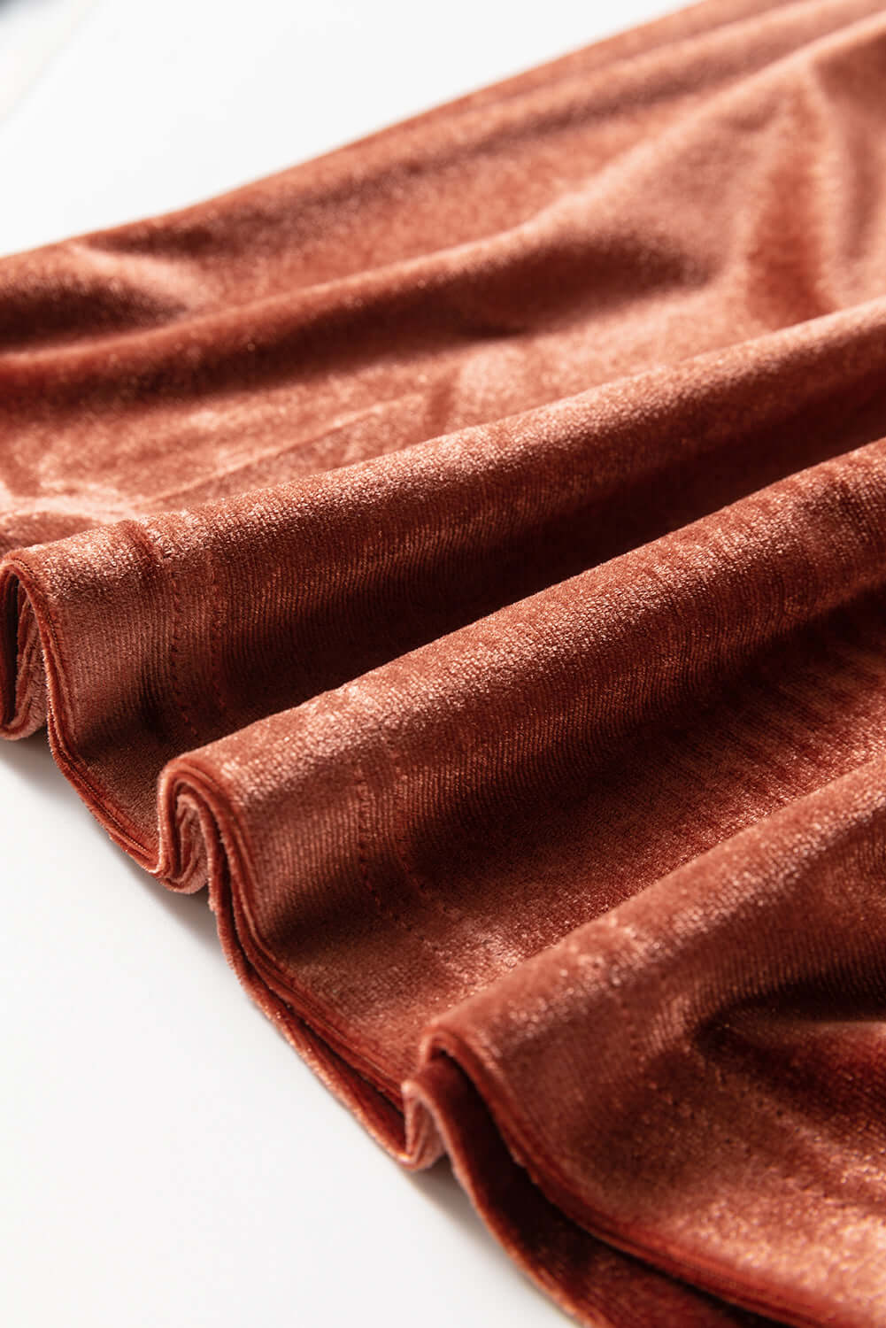 Copper velvet fabric of PENNY FOR YOUR THOUGHTS Maxi Dress by Vivian-Lu, showcasing luxurious texture and rich color.