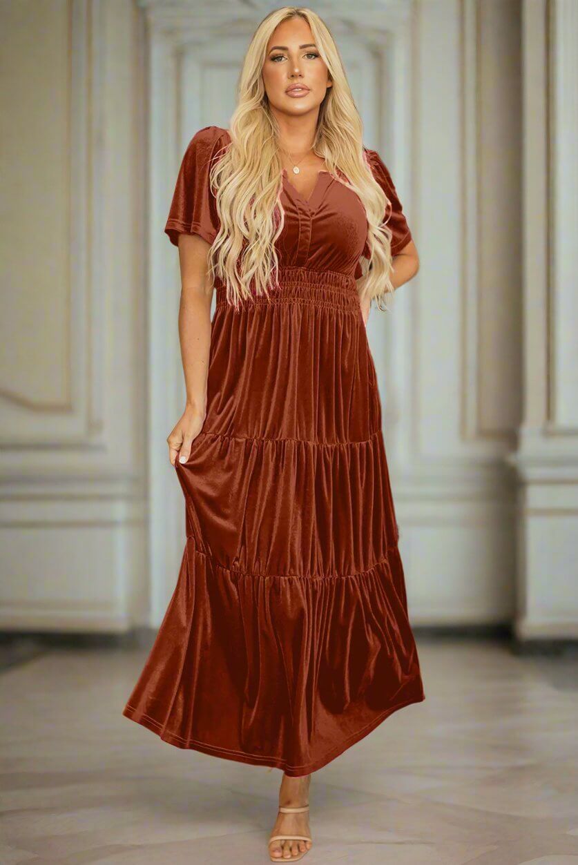 Copper velvet maxi dress with tiered design and shirred waist by Vivian-Lu, creating an elegant silhouette for any occasion.