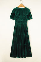 Elegant Emerald Maxi velvet dress with short sleeves and tiered design, featuring a flattering V-neck cut for a chic boho-inspired look.