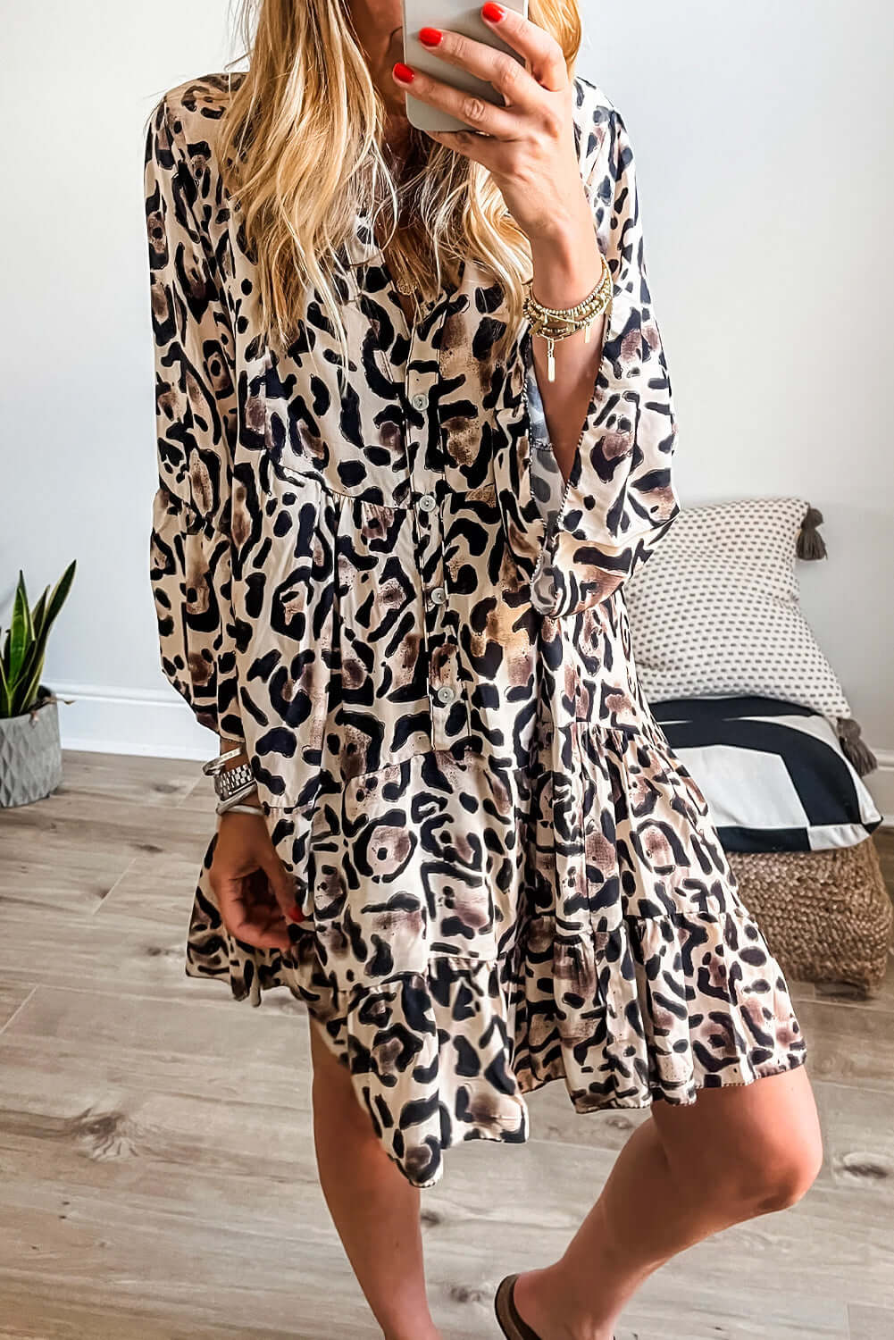 Walk on the Wild Side dress with leopard print, button front, tiered ruffles, and flowy fabric, perfect for a standout look.