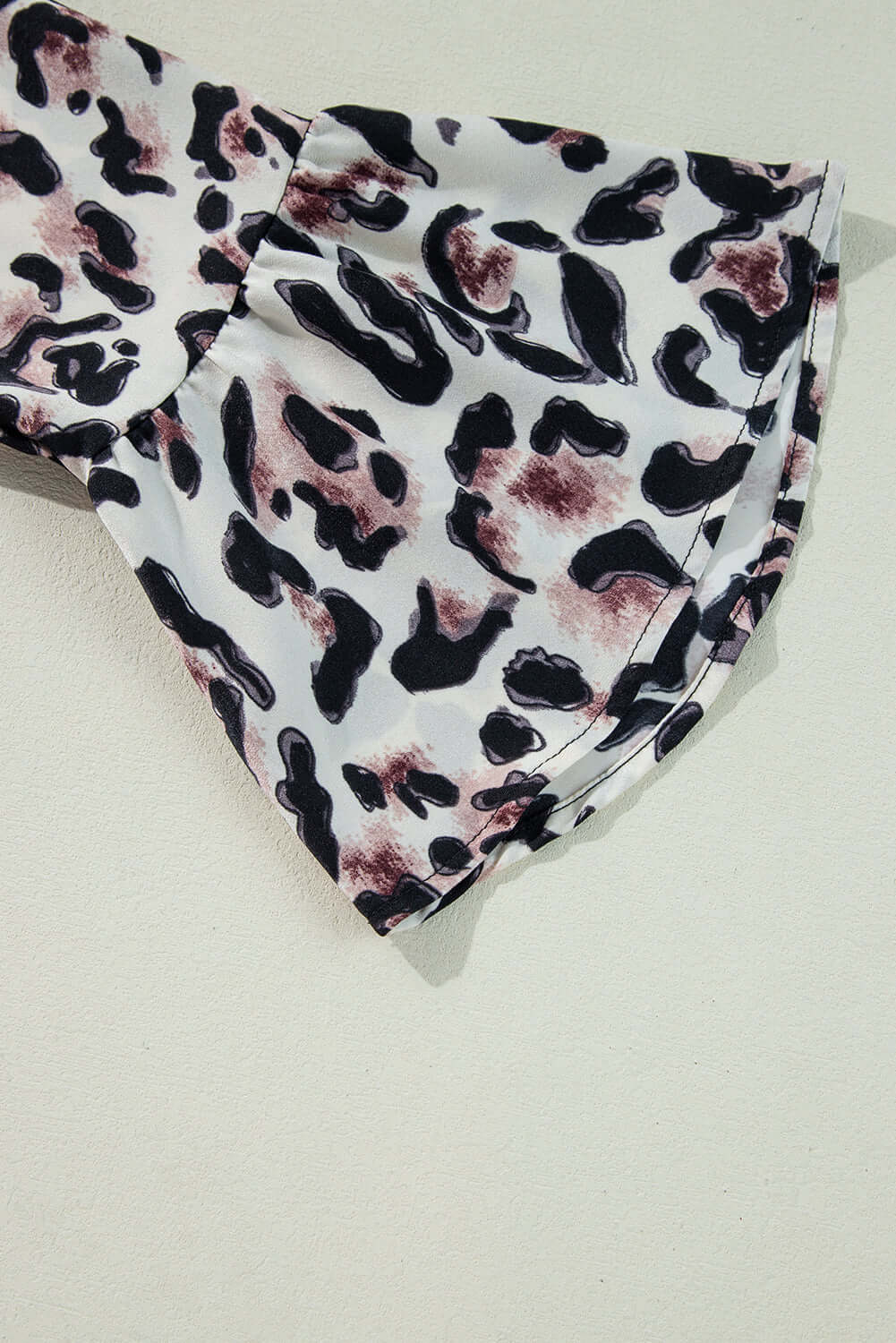 Leopard print fabric detail of Walk on The Wild Side dress showcasing soft polyester and playful ruffles.