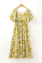 Spring Time Maxi Dress with floral print and scalloped trim, perfect for a romantic outdoor look.