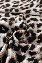 Leopard print fabric showcasing the elegant design of the Untamed Beauty maxi dress.