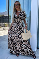 Untamed Beauty leopard print maxi dress with deep V-neck and cinched waist, perfect for confident summer style.