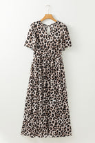 Leopard print maxi dress with deep V-neckline and cinched waist, showcasing effortless glamour and style.