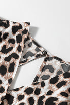 Detail view of the Untamed Beauty leopard print maxi dress showcasing its deep V-neckline and stylish flutter sleeves.