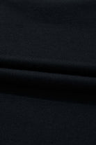 close-up of soft, black fabric showcasing its smooth texture and drape, perfect for stylish clothing.