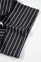 Black and white striped fabric detail of the Perfect Pathways Dress with ruffle sleeves.