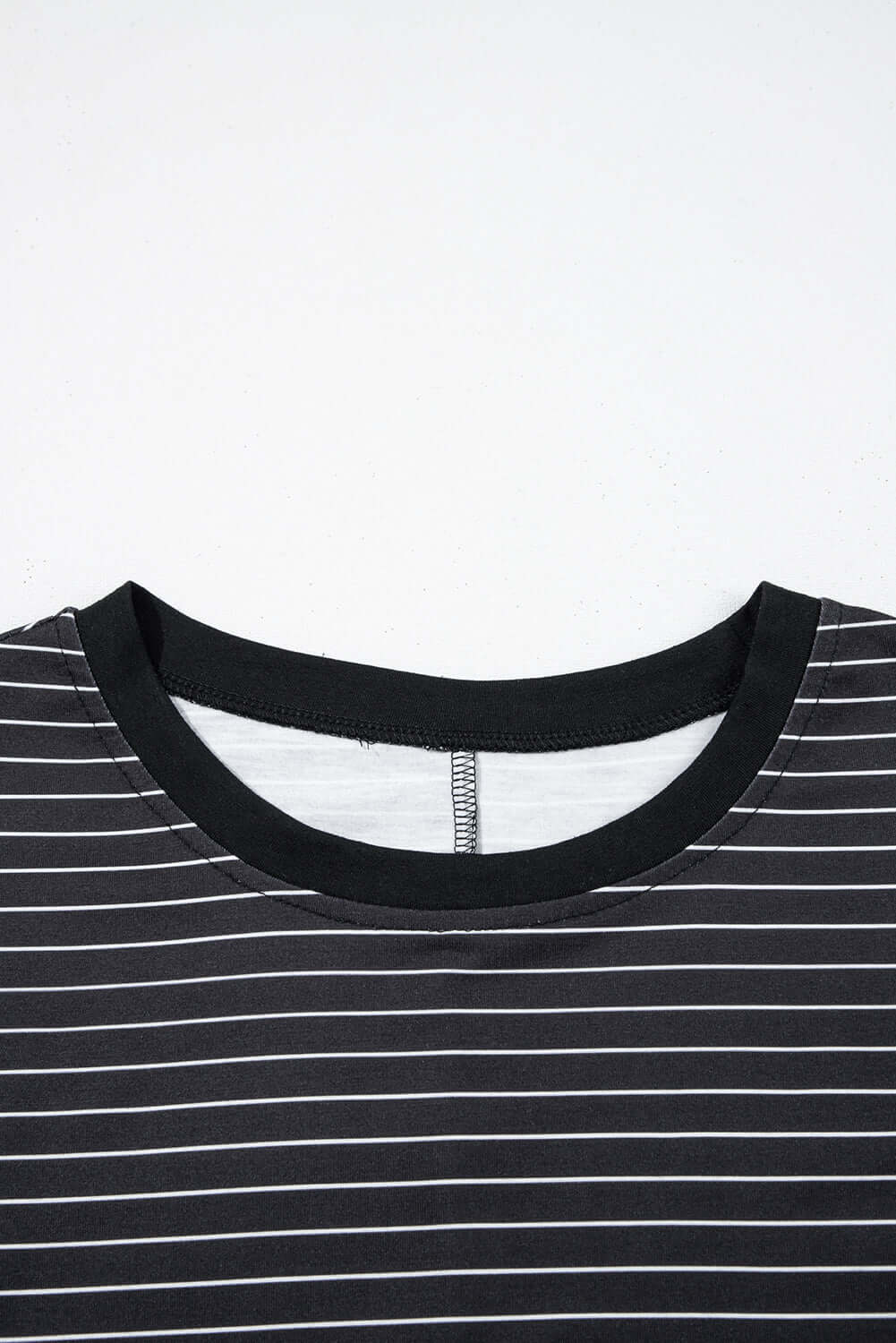 Black and white striped mini T-shirt dress neckline with soft fabric and ruffle detail.