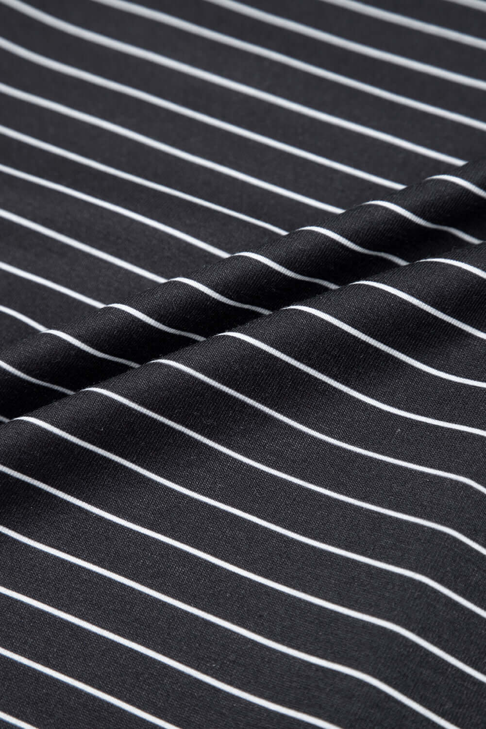 Close-up of black and white striped fabric highlighting the soft texture of the Perfect Pathways Dress.