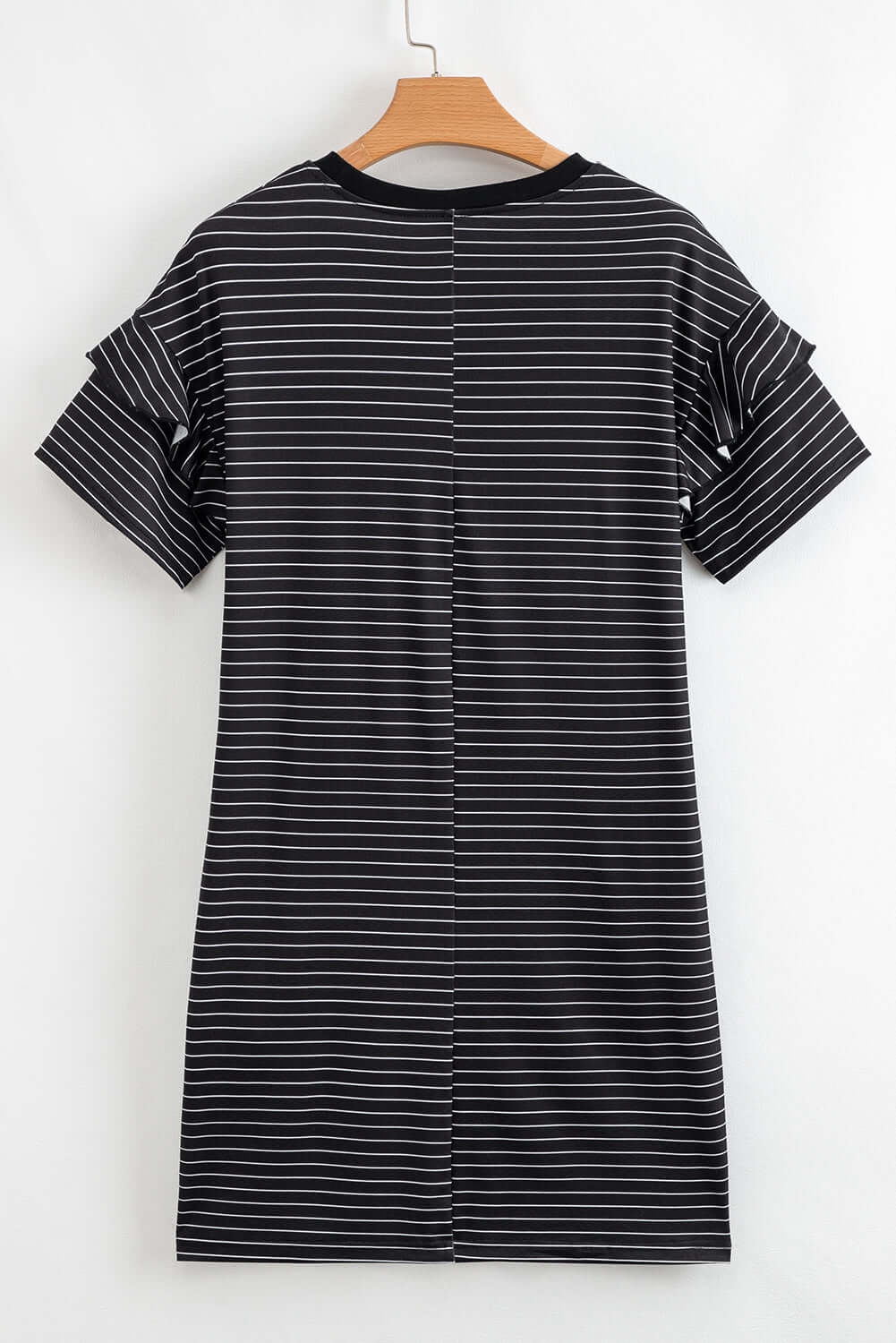 Back view of the Perfect Pathways Dress featuring black and white stripes with ruffle sleeves.