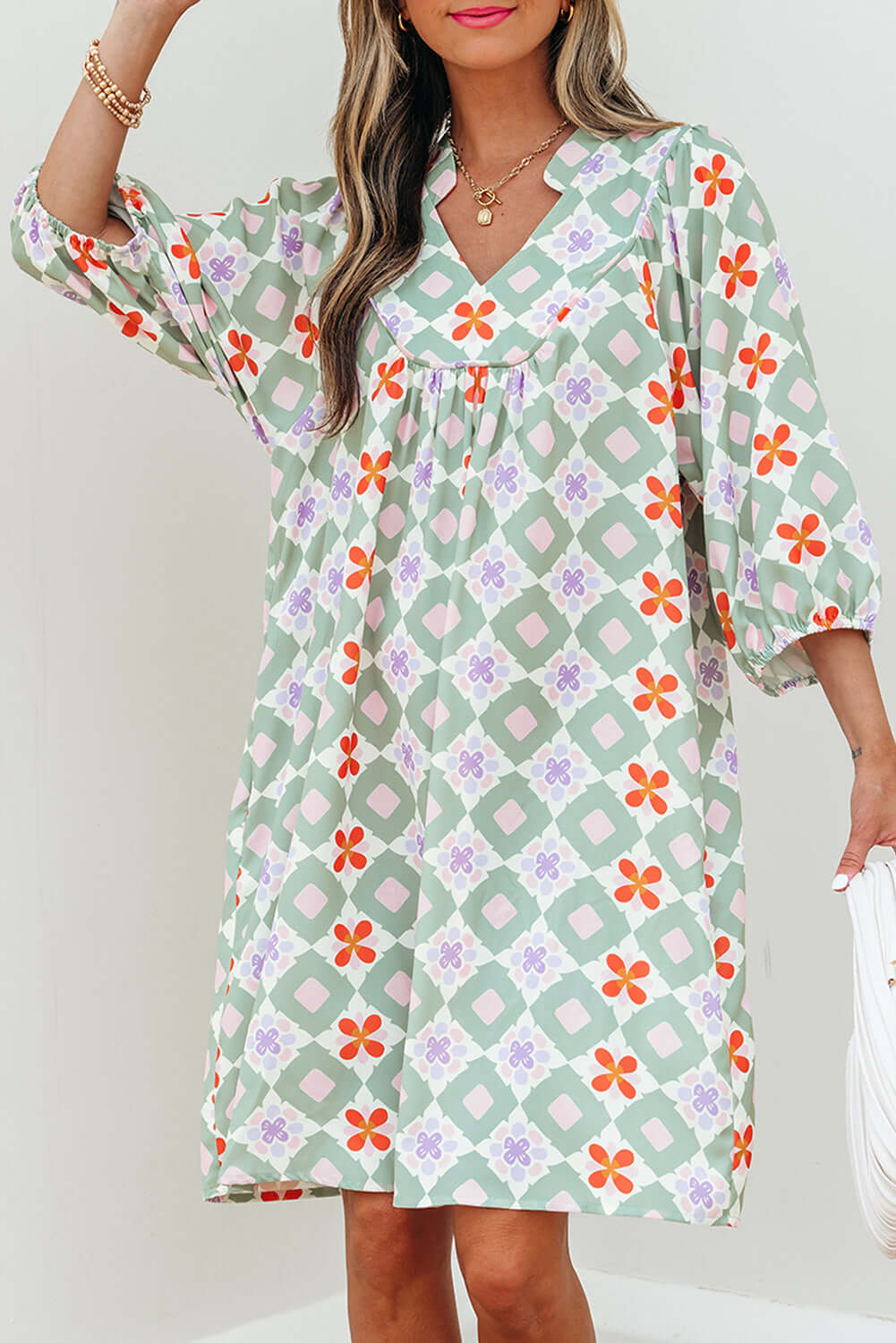 Mint Mosaic Dress featuring green geometric floral print, knee-length, loose fit, and 3/4 puff sleeves.