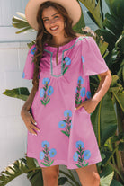 Bright magenta Coastal Kiss Dress with floral print, perfect for sunny days and seaside strolls.