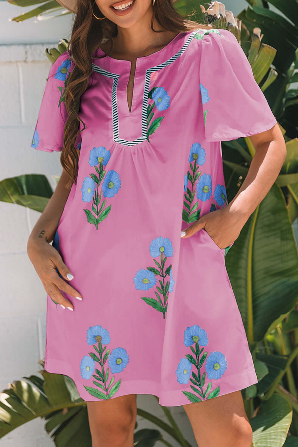 Playful magenta Coastal Kiss Dress with floral print, perfect for sunny days and seaside strolls.