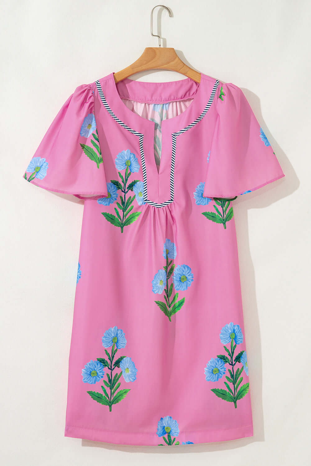 Magenta Coastal Kiss Dress with blue floral print and puff sleeves, perfect for sunny days and seaside strolls.