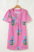 Magenta Coastal Kiss Dress with blue floral print and puff sleeves, perfect for sunny days and seaside strolls.