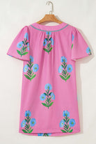Coastal Kiss Dress in magenta with floral print, perfect for sunny days and seaside strolls.